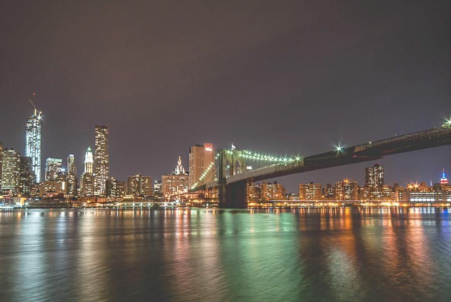 Nighttime view of Brooklyn Bridge and the Financial District