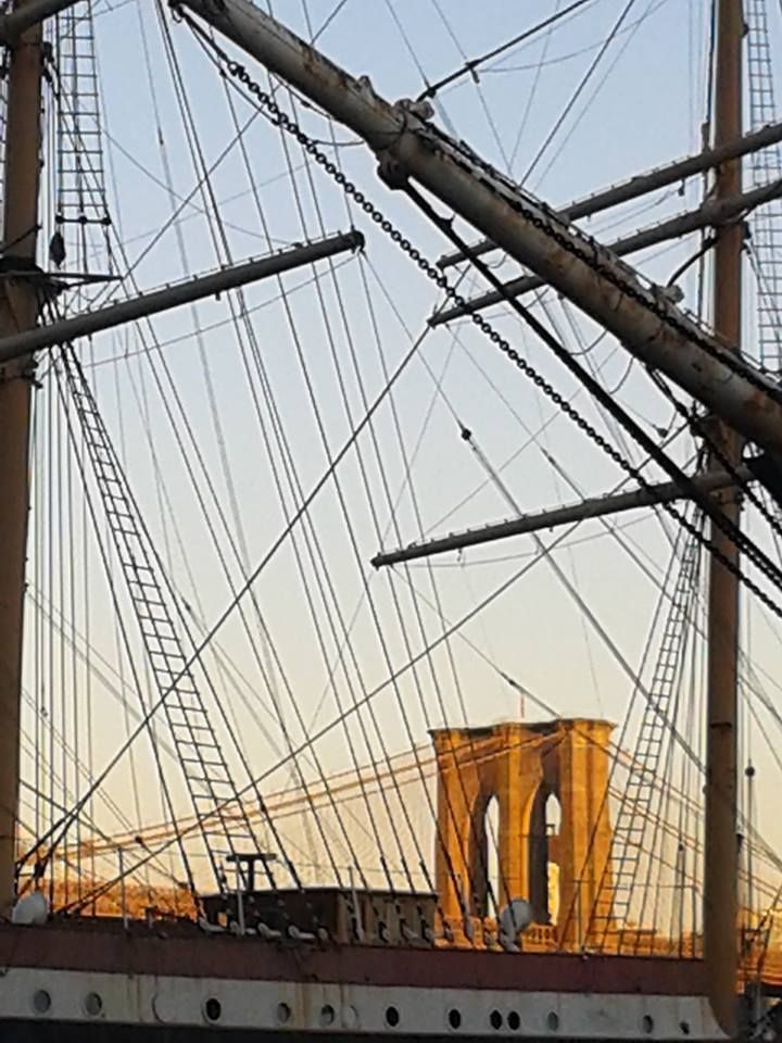 Brooklyn Bridge framed by the masts of sailing ships at South Street Seaport