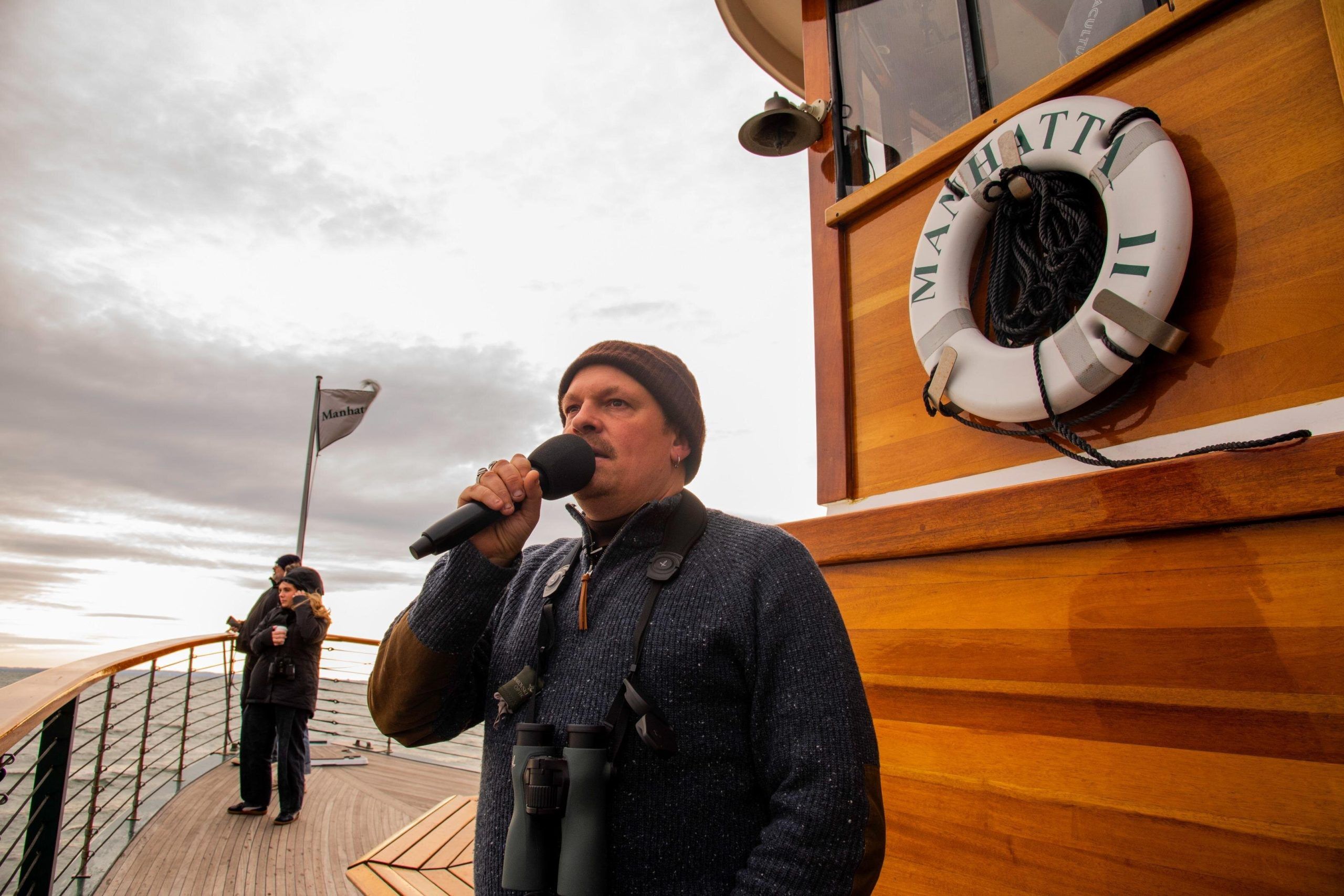 naturalist guide on the deck of a cruise ship in New York