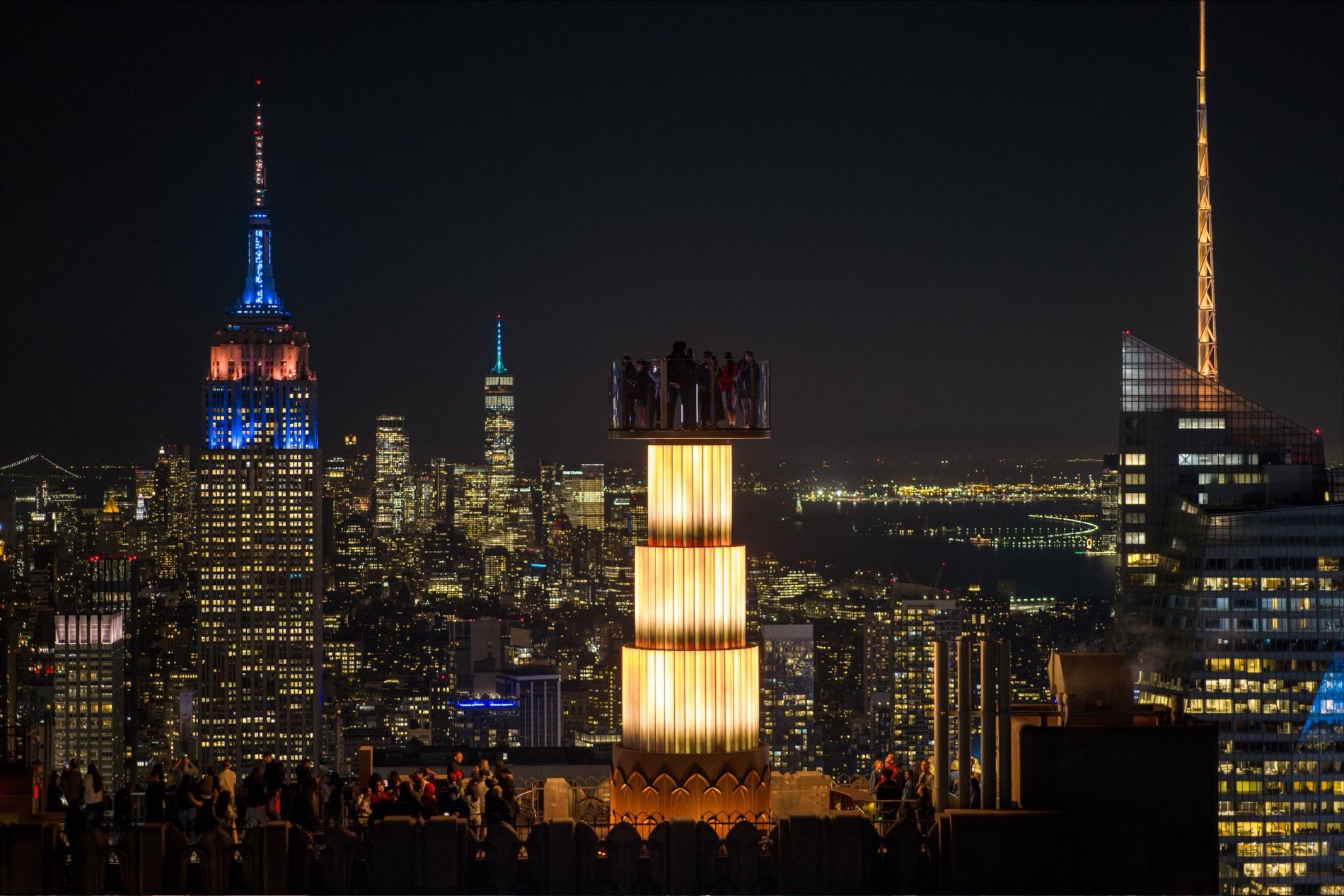 Tourists aboard the SkyLift attraction at Top of the Rock in New York
