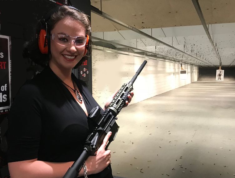 Young woman at a shooting range in New York for her birthday